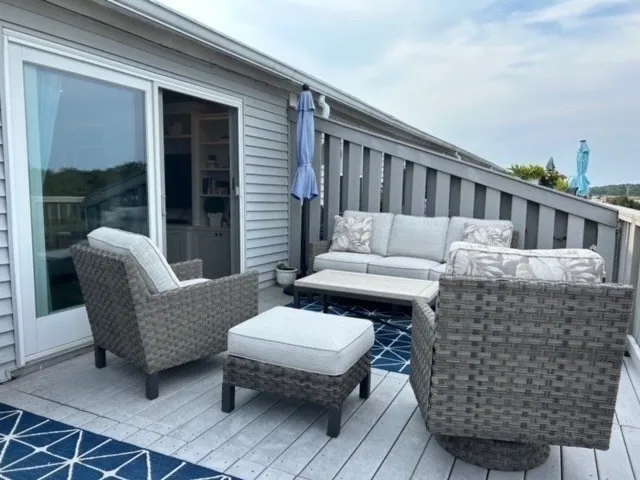 a view of a patio with couches chairs and table and chairs