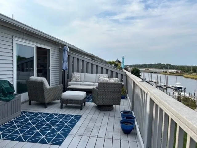 a view of roof deck with furniture