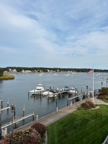 45 Main Street, Unit 221 Wareham, MA 02571 - Photo 33 of 36 a view of a lake with houses in the back