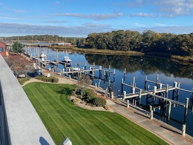 45 Main Street, Unit 221 Wareham, MA 02571 - Photo 35 of 36 a view of a city with lawn chairs and a table