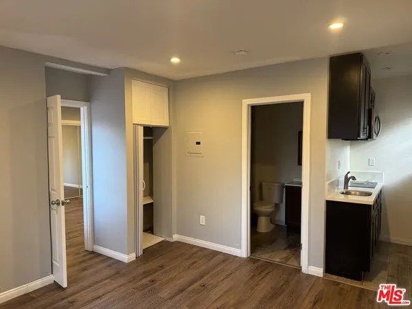 a kitchen with a sink and a refrigerator