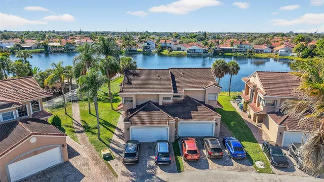 an aerial view of a house with a lake view