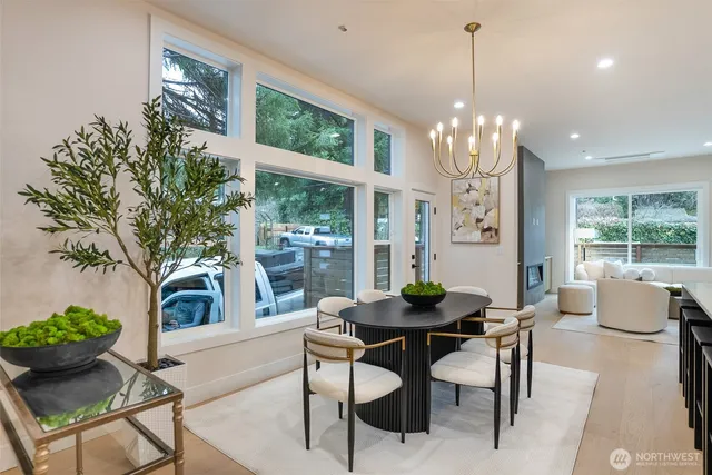 a view of a dining room with furniture window and outside view