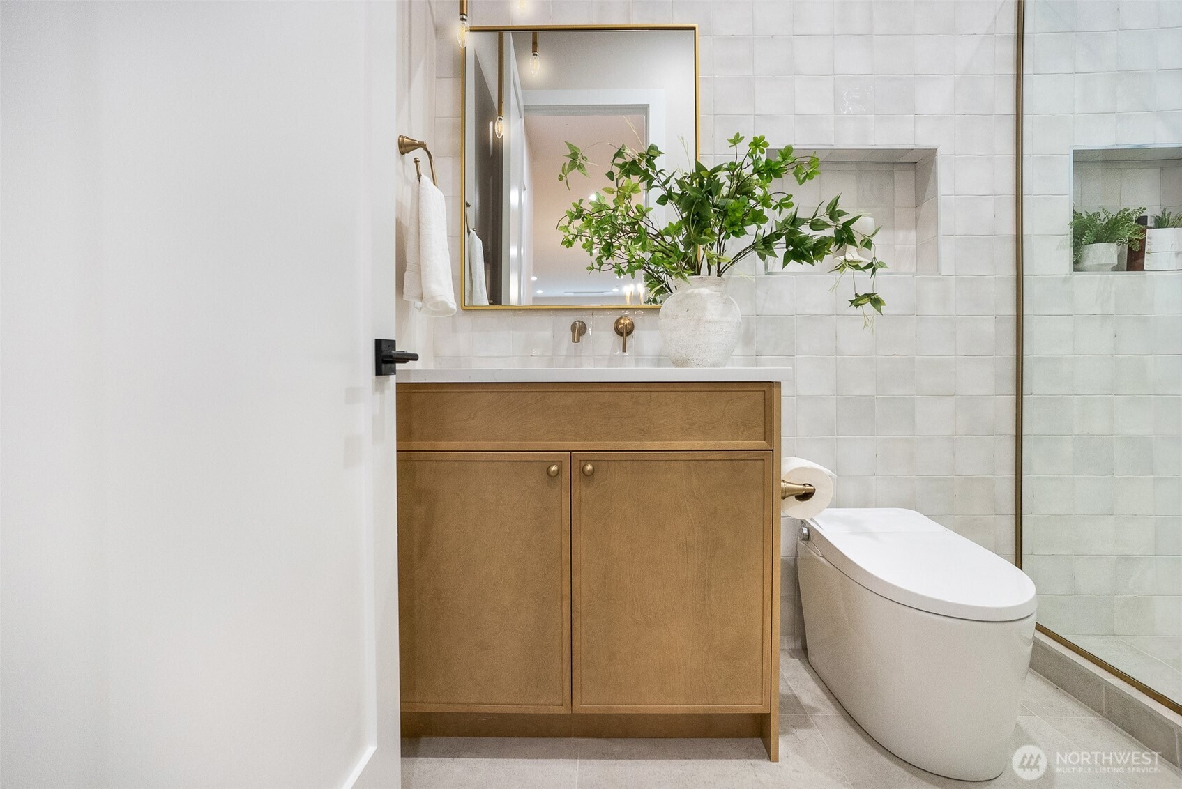 18607 104th Avenue Northeast, Unit B Bothell, WA 98011 - Photo 15 of 29 a bathroom with a toilet a sink and mirror