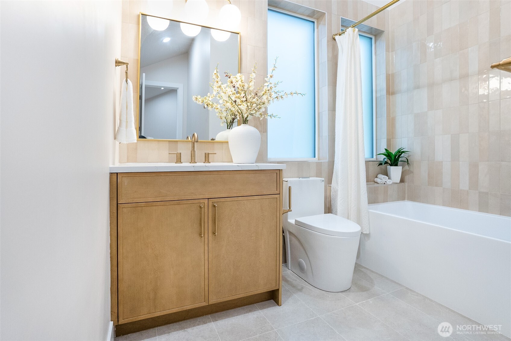 18607 104th Avenue Northeast, Unit B Bothell, WA 98011 - Photo 20 of 29 a bathroom with a sink a toilet and shower