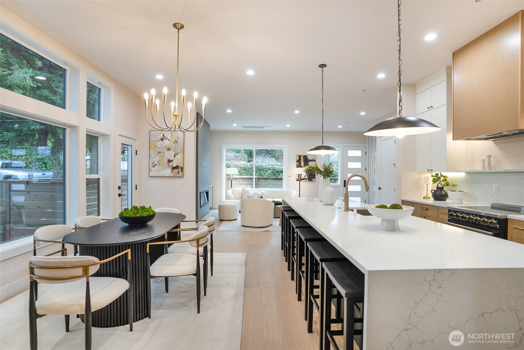 18607 104th Avenue Northeast, Unit B Bothell, WA 98011 - Photo 10 of 29 a dining room filled chandelier and kitchen view