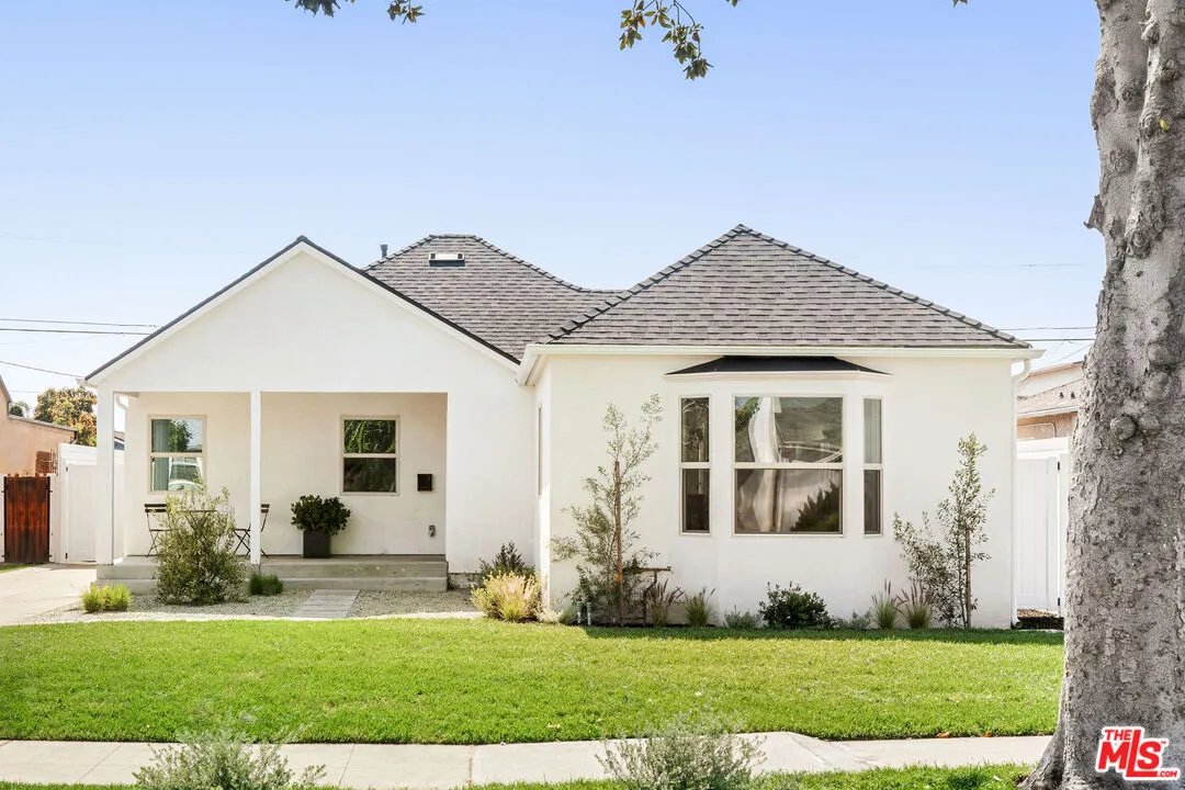 3789 Hepburn Avenue Los Angeles, CA 90018 - Photo 1 of 1 a front view of a house with a yard