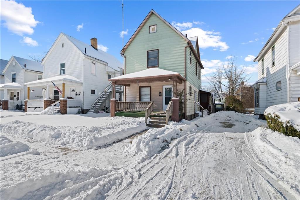 768 Baldwin Avenue Sharon, PA 16146 - Photo 12 of 13 a view of a house with a yard and sitting area