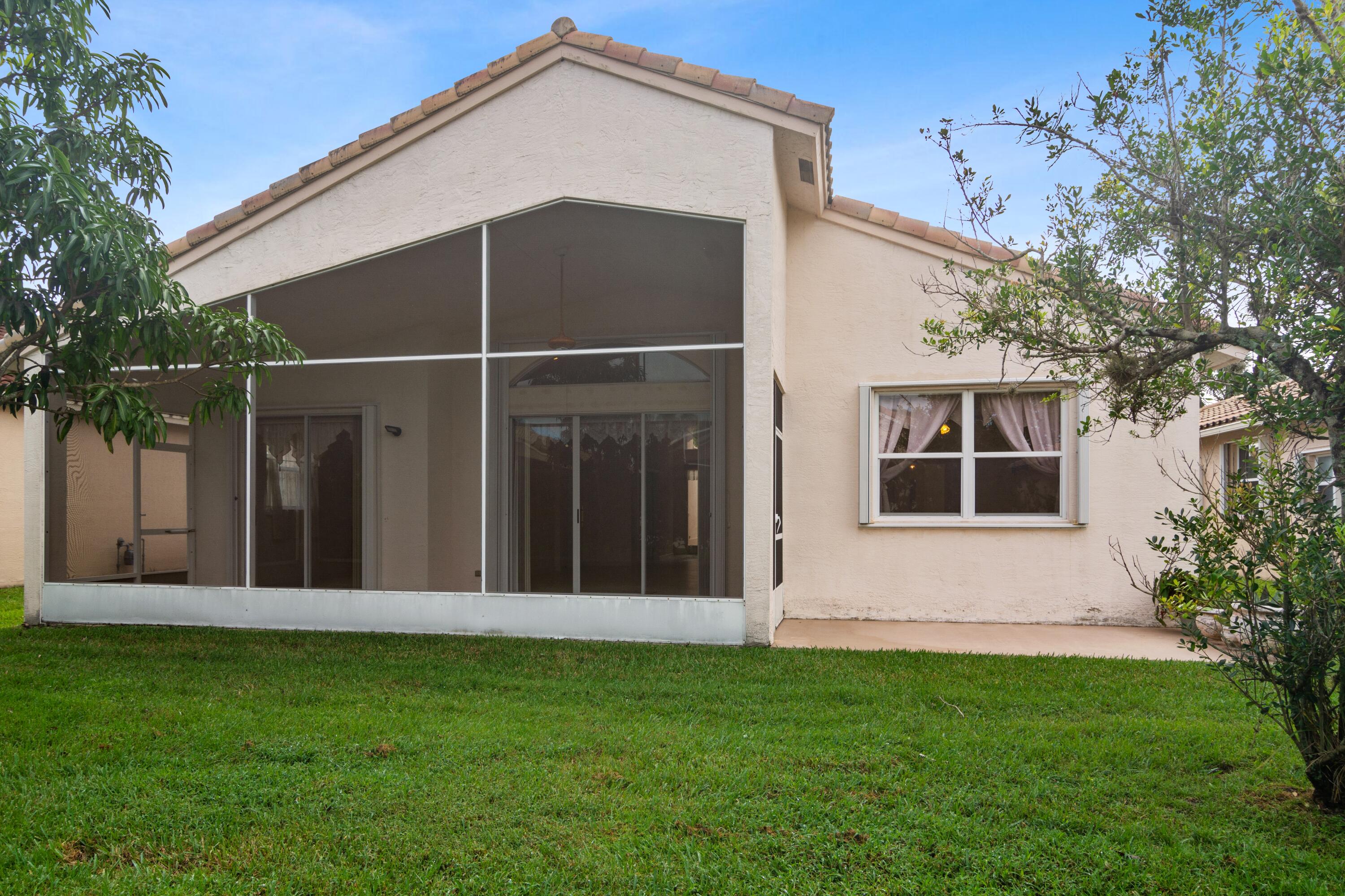 403 Springview Loop Port St. Lucie, FL 34986 - Photo 15 of 52 15_403NWSpringviewLoop_59_RearView_HiRes