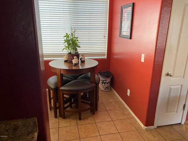 a room with furniture and a potted plant