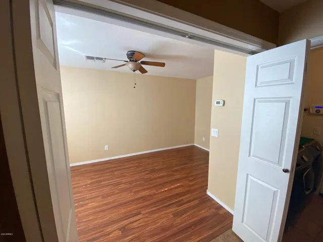 a view of a room with wooden floor and staircase