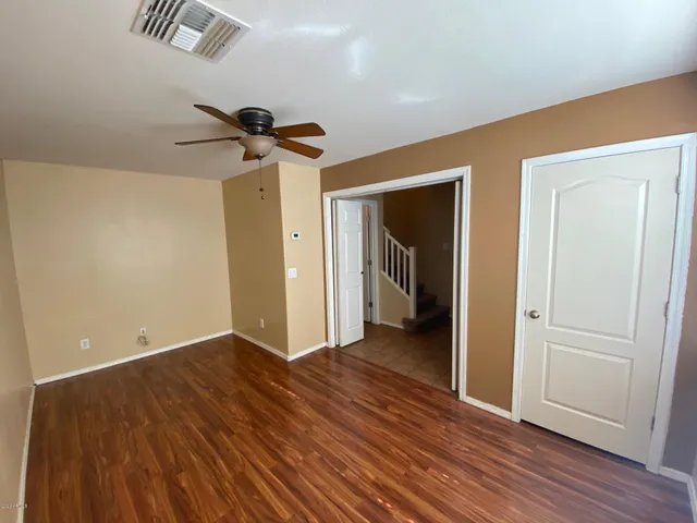 a view of hallway with wooden floor