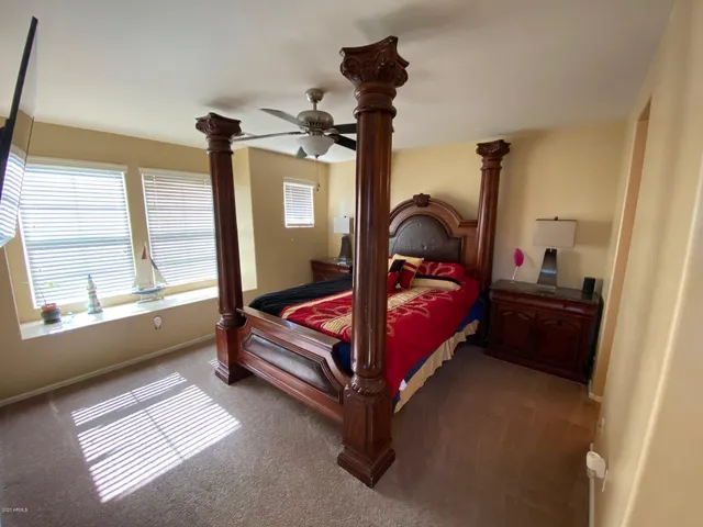 a bed room with a bed and a window