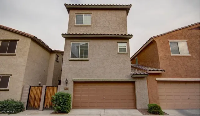 a front view of a house with garage