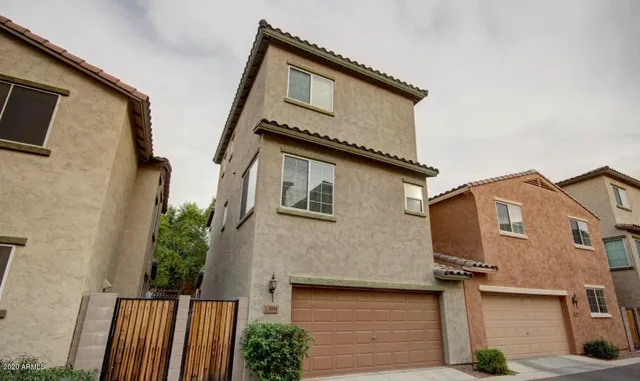 a front view of a house with garage