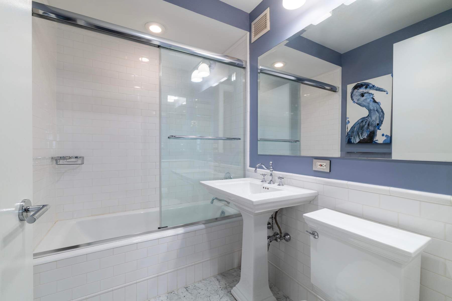 43 West 64th Street, Unit 4B Manhattan, NY 10023 - Photo 11 of 15 a bathroom with a sink mirror toilet and bathtub