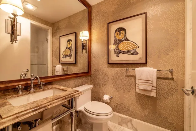 a bathroom with a sink mirror toilet and bathtub