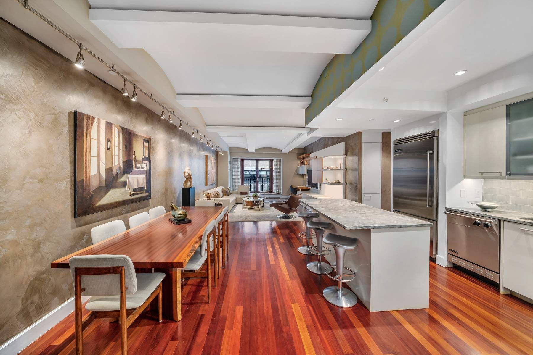 43 West 64th Street, Unit 4B Manhattan, NY 10023 - Photo 4 of 15 a view of a dining room with furniture a rug and wooden floor