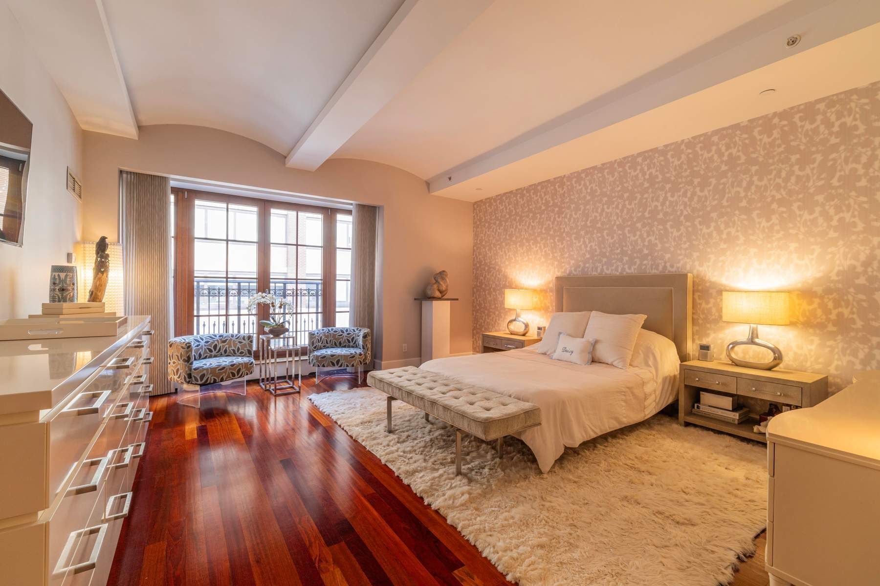 43 West 64th Street, Unit 4B Manhattan, NY 10023 - Photo 6 of 15 a bedroom with a bed and wooden floor