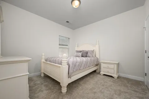 a view of a livingroom with wooden floor and closet