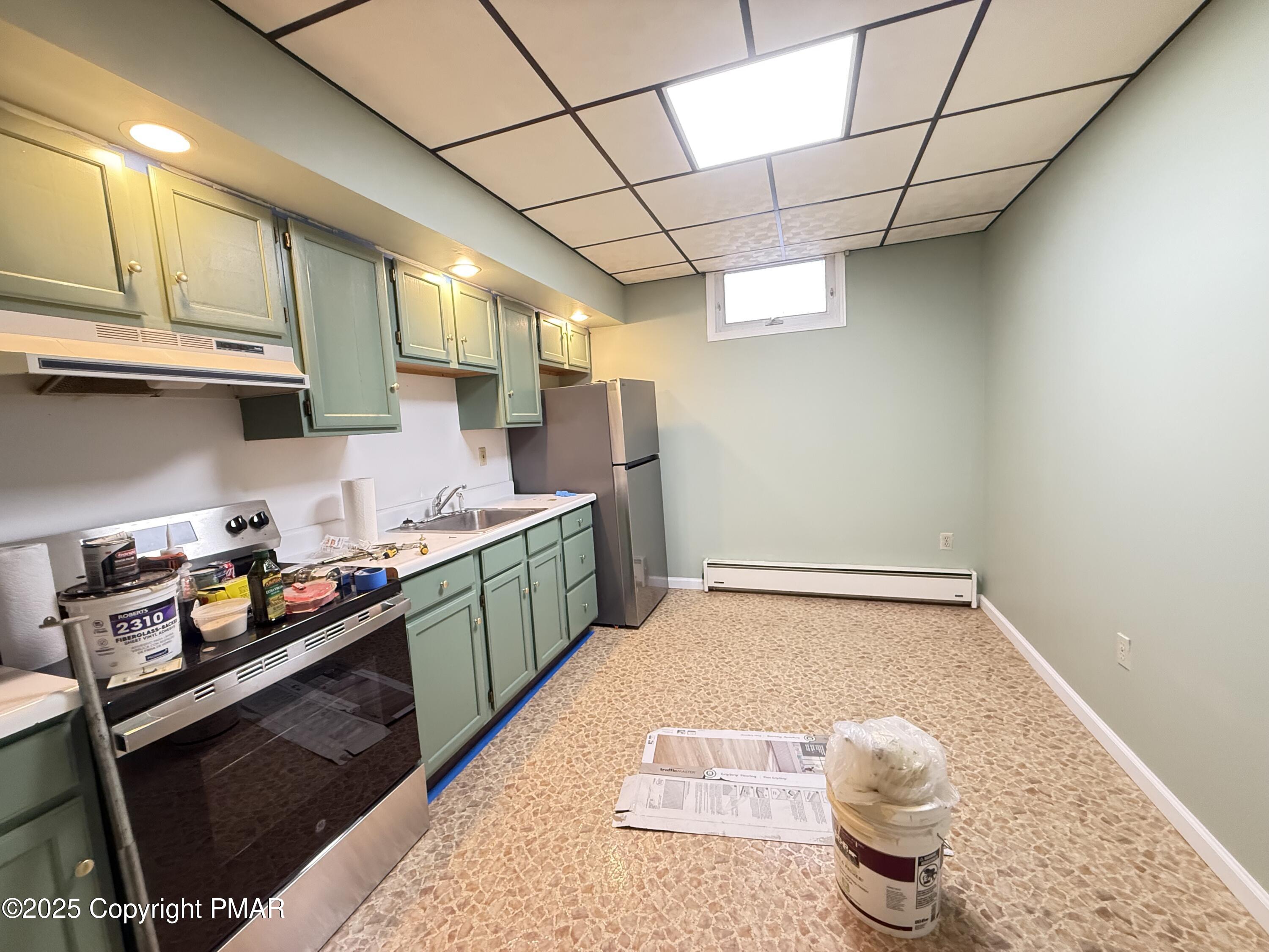 132 East Main Street Girardville, PA 17935 - Photo 1 of 8 a kitchen with granite countertop lots of clutter and stainless steel appliances