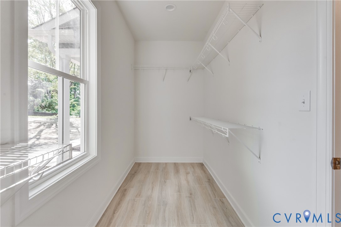 1393 Broad St Road Oilville, VA 23129 - Photo 28 of 39 Walk in closet featuring light wood-style floors