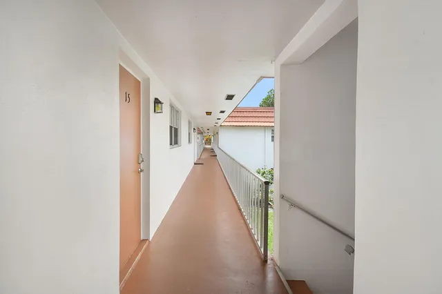 a view of a hallway with stairs