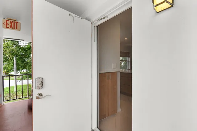 a view of a hallway with a window