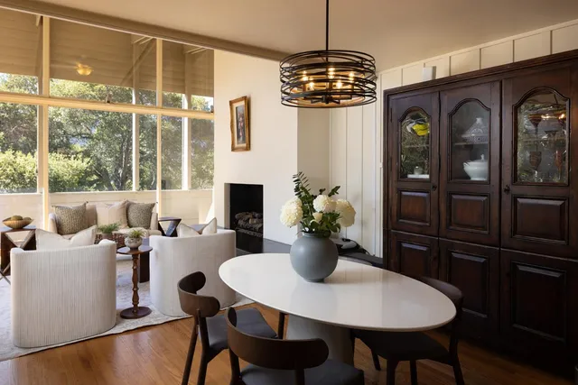a view of a dining room with furniture window and wooden floor