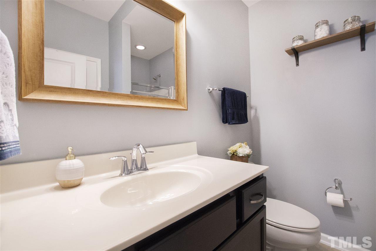 725 Wickham Ridge Road Apex, NC 27539 - Photo 16 of 30 Main Level Full Bathroom with Updated Vanity and Mirror