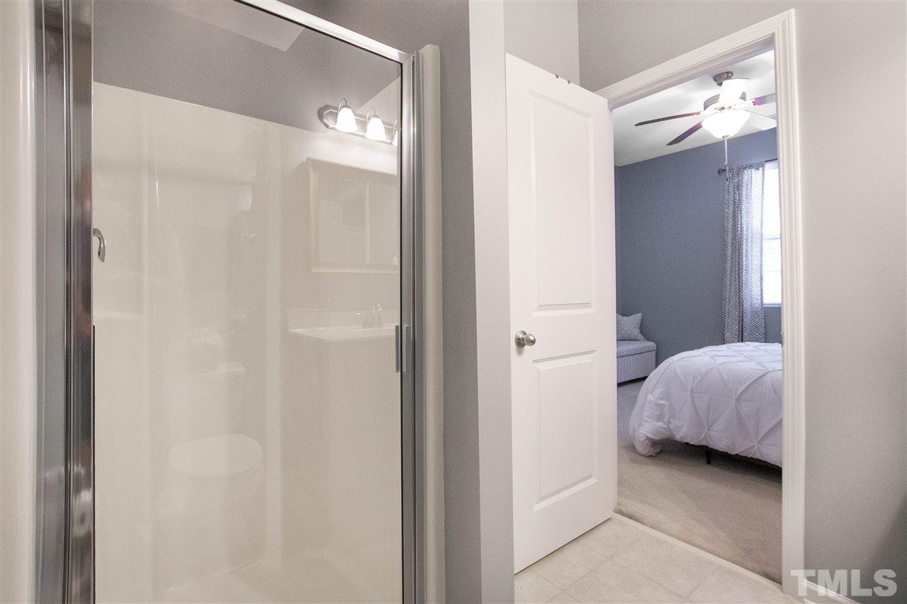 725 Wickham Ridge Road Apex, NC 27539 - Photo 17 of 30 Bathroom features a Walk-In Shower with Glass Door Enclosure