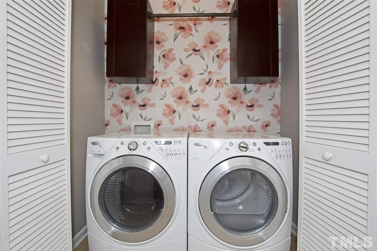 725 Wickham Ridge Road Apex, NC 27539 - Photo 22 of 30 Laundry Closet with Shelving, Hanging Rod, and Removable Wallpaper Accent Wall