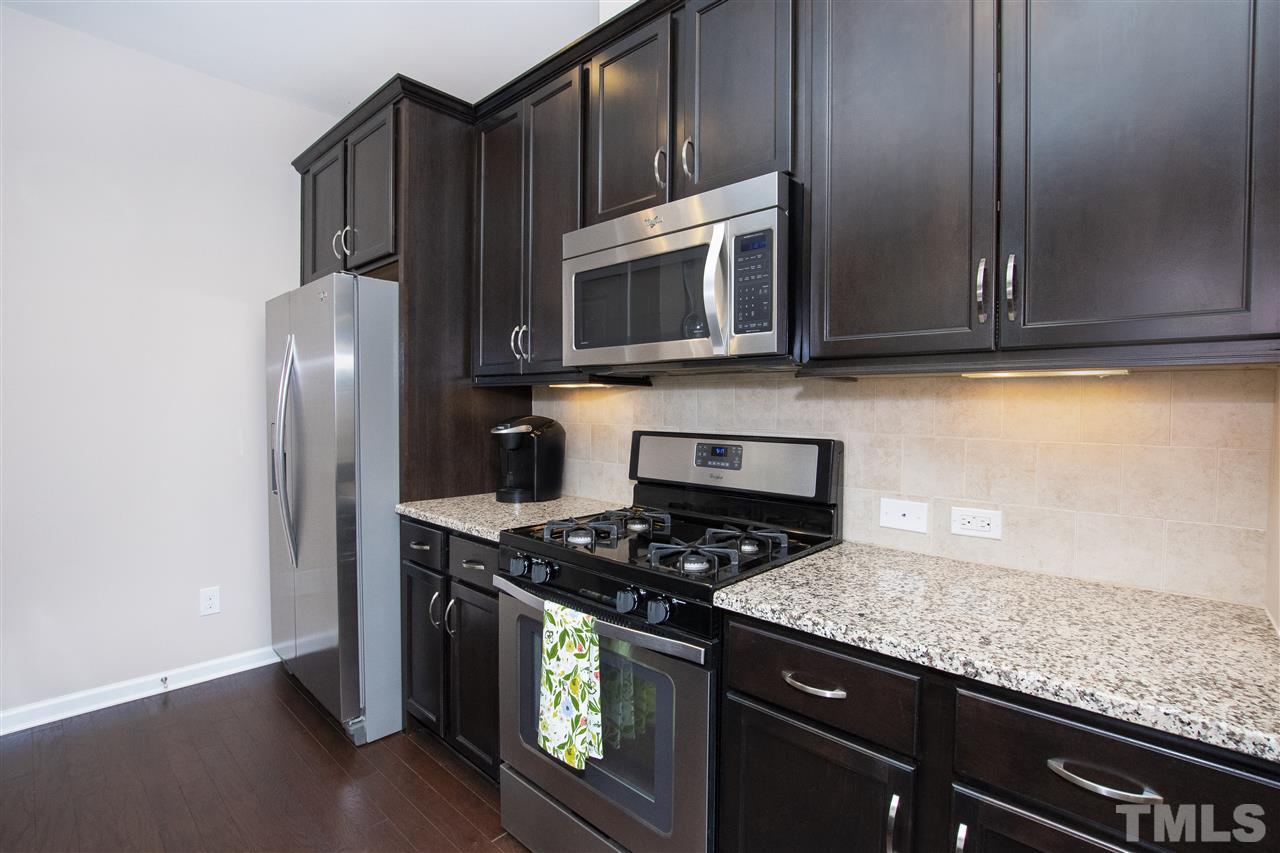725 Wickham Ridge Road Apex, NC 27539 - Photo 6 of 30 Under Cabinet Lighting and Plentiful Counter Space