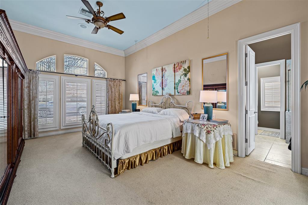 8908 Brierfield Road Granbury, TX 76049 - Photo 17 of 40 a bed sitting in a spacious bedroom next to a window