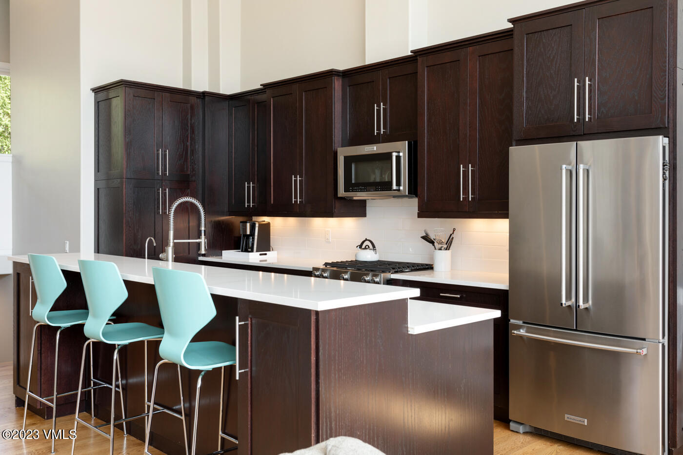 68 Hackamore Road Edwards, CO 81632 - Photo 2 of 22 a kitchen with granite countertop a refrigerator stove and microwave