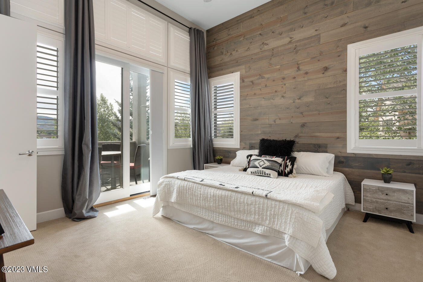 68 Hackamore Road Edwards, CO 81632 - Photo 9 of 22 a bedroom with a bed and a large window