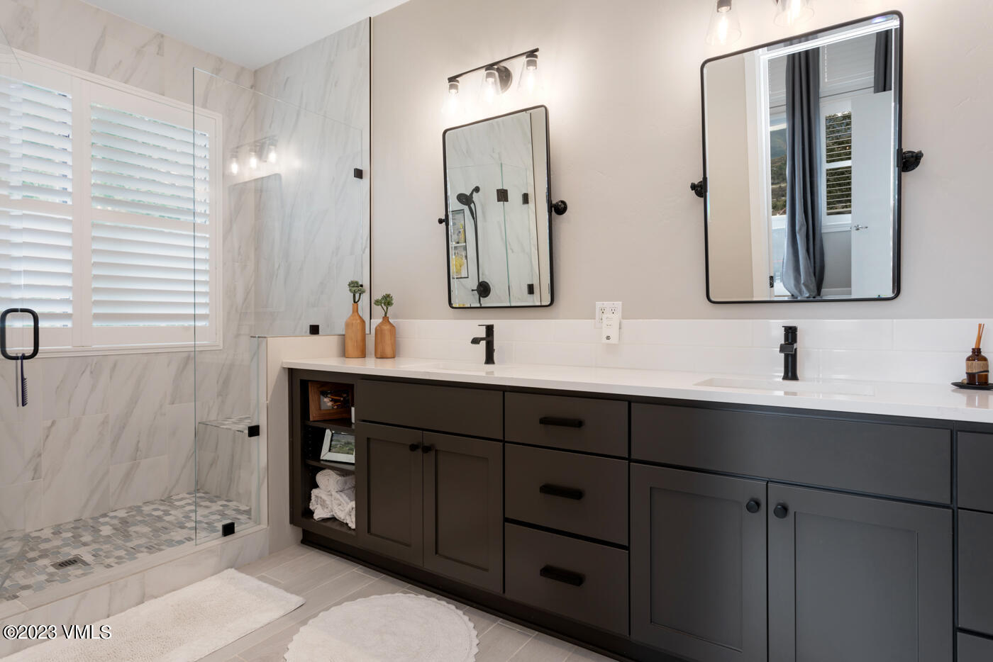 68 Hackamore Road Edwards, CO 81632 - Photo 10 of 22 a bathroom with double sink and a mirror
