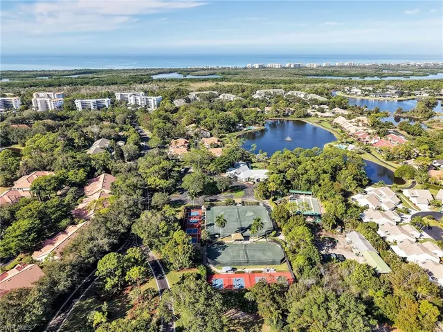 an aerial view of residential building and lake