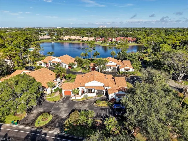 an aerial view of a house with a lake view