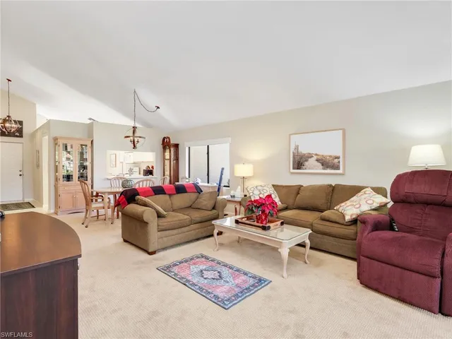 a living room with furniture and a couch