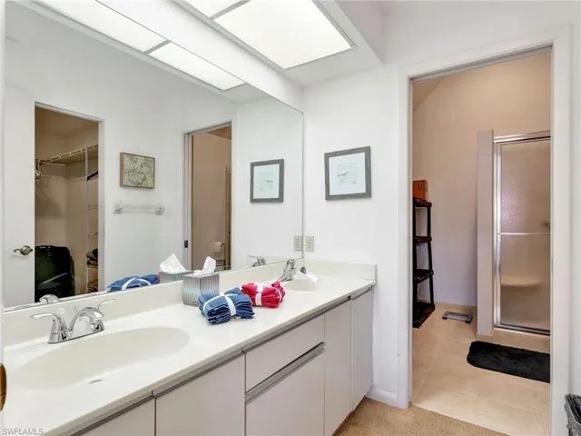 a bathroom with a sink vanity and a mirror