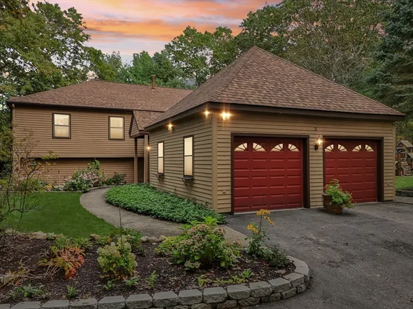 a front view of a house with garden