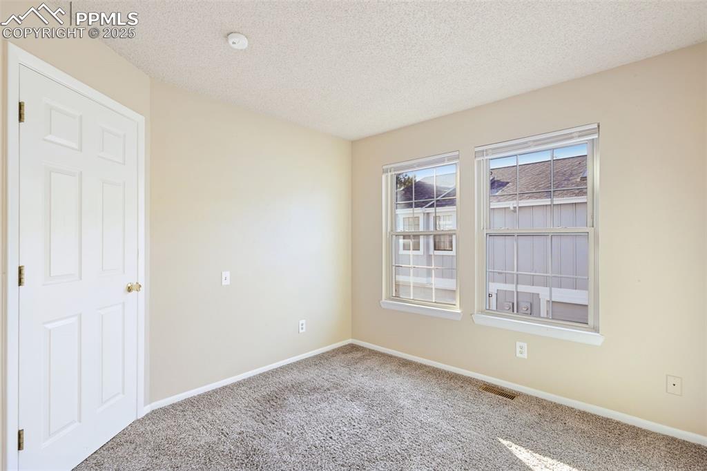 2575 Hatch Circle Colorado Springs, CO 80918 - Photo 11 of 39 a view of an empty room with a window