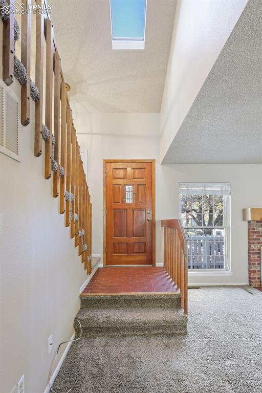 2575 Hatch Circle Colorado Springs, CO 80918 - Photo 15 of 39 a spacious bedroom with a bed and glass windows