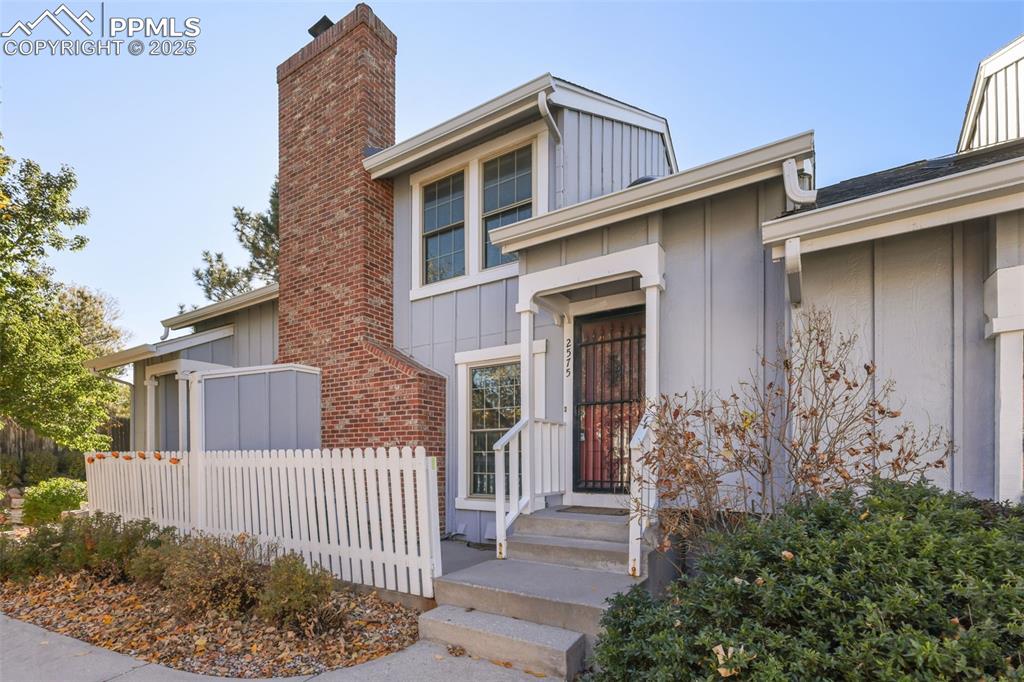 2575 Hatch Circle Colorado Springs, CO 80918 - Photo 2 of 39 a front view of a house with garden