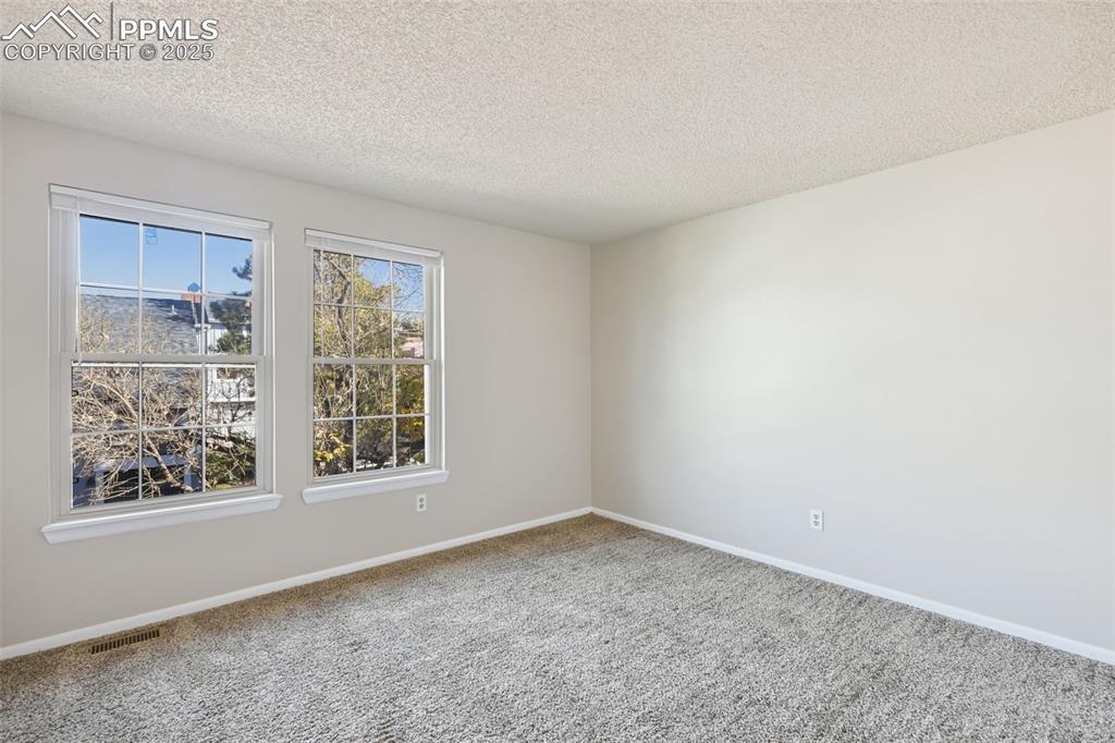 2575 Hatch Circle Colorado Springs, CO 80918 - Photo 24 of 39 an empty room with a window