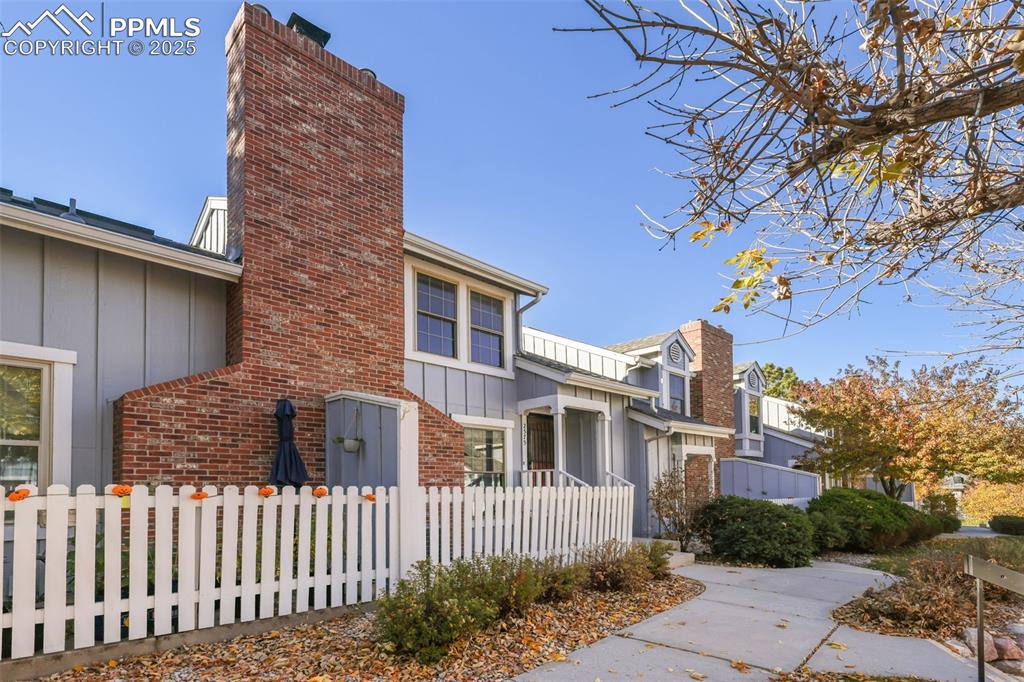 2575 Hatch Circle Colorado Springs, CO 80918 - Photo 34 of 39 a front view of a house with a garden