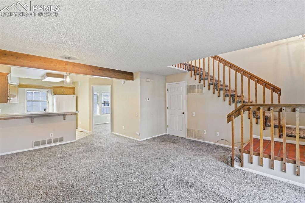 2575 Hatch Circle Colorado Springs, CO 80918 - Photo 6 of 39 a view of an empty room with stairs