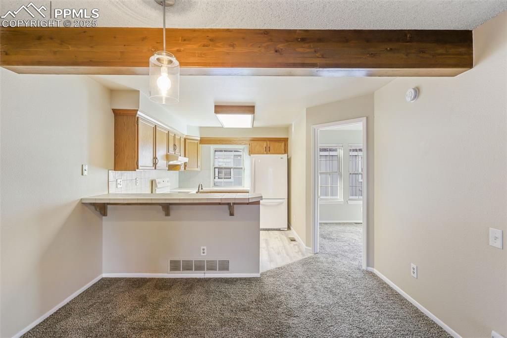 2575 Hatch Circle Colorado Springs, CO 80918 - Photo 7 of 39 a view of a kitchen with a sink and cabinets