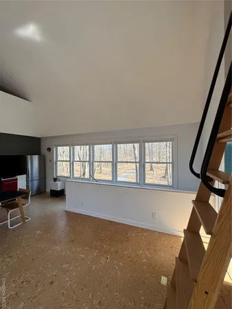 an empty room with windows